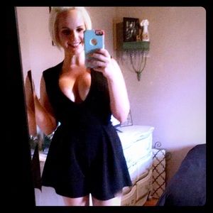 Black low cut romper.